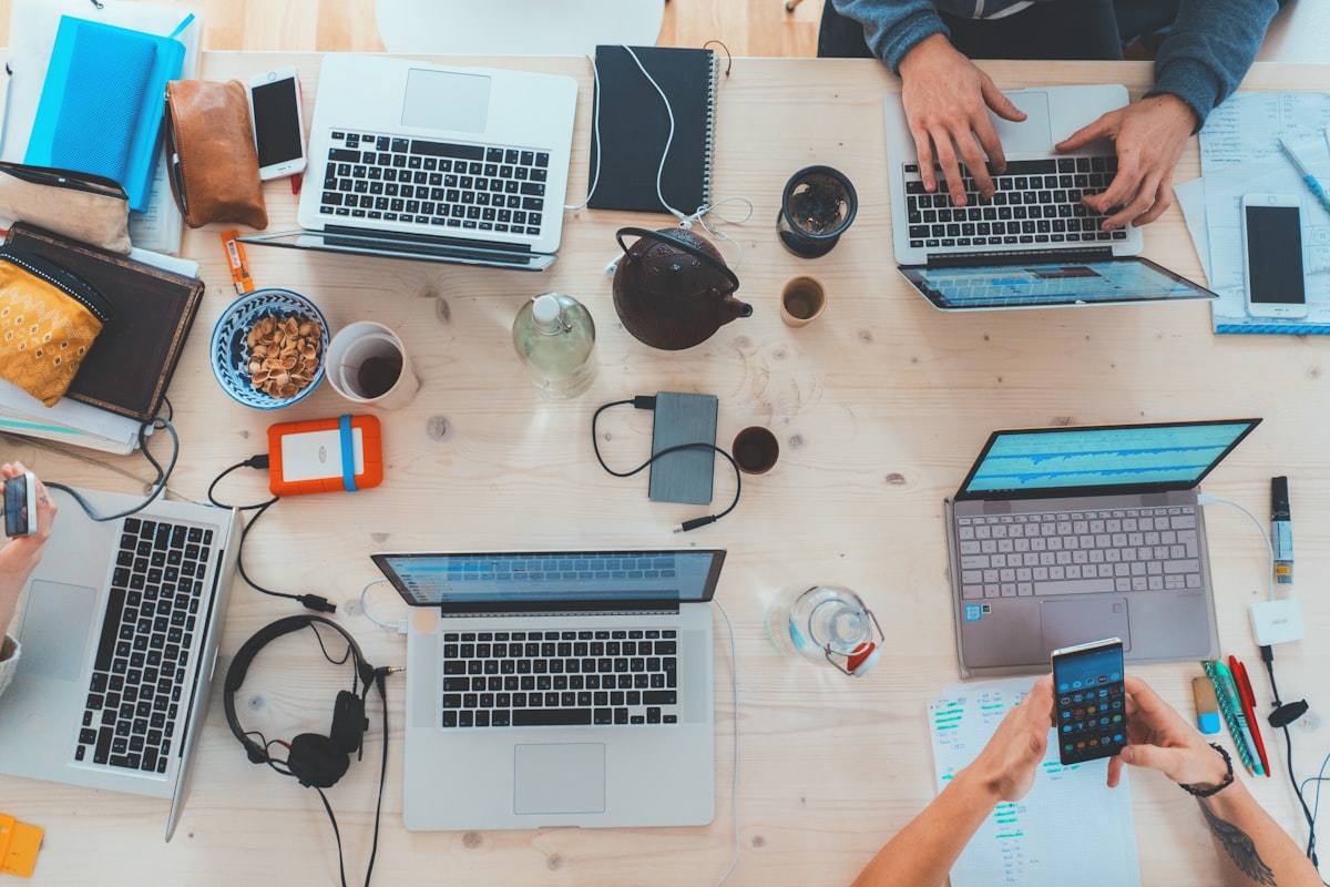 Small business team around laptops